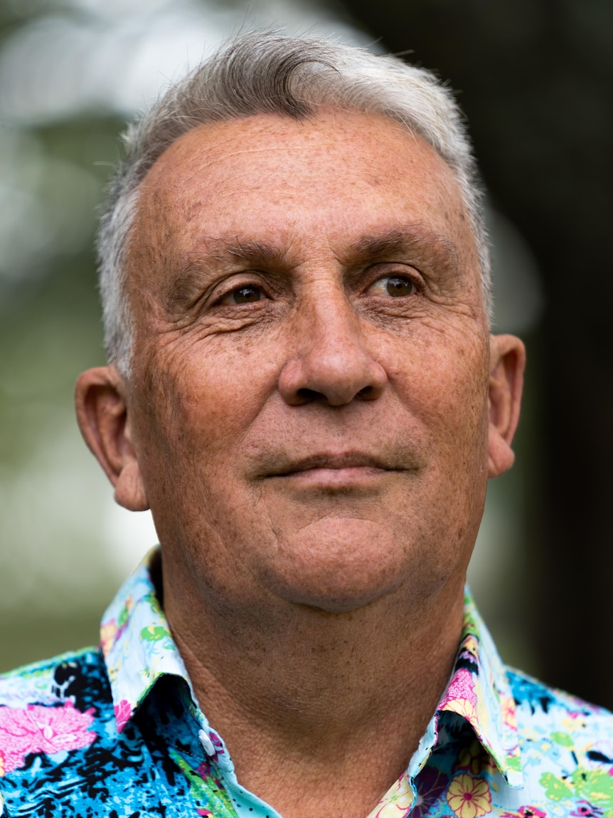 An Indigenous man with short white hair.