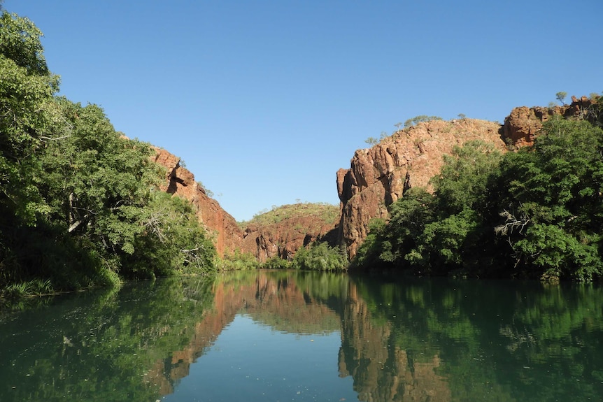 Scenic view from the water of deep red gorge