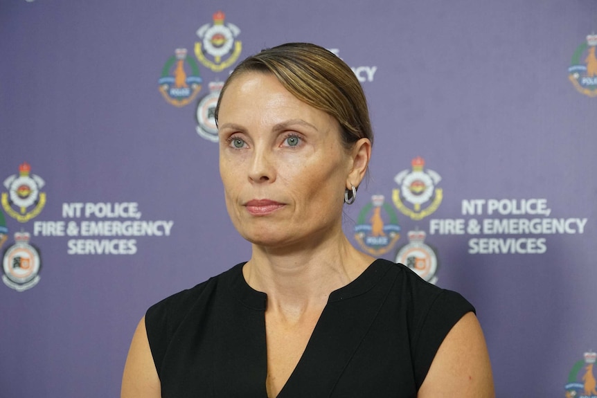 Acting Senior Sergeant Kirsten Engels has a serious expression and is front of a purple background.
