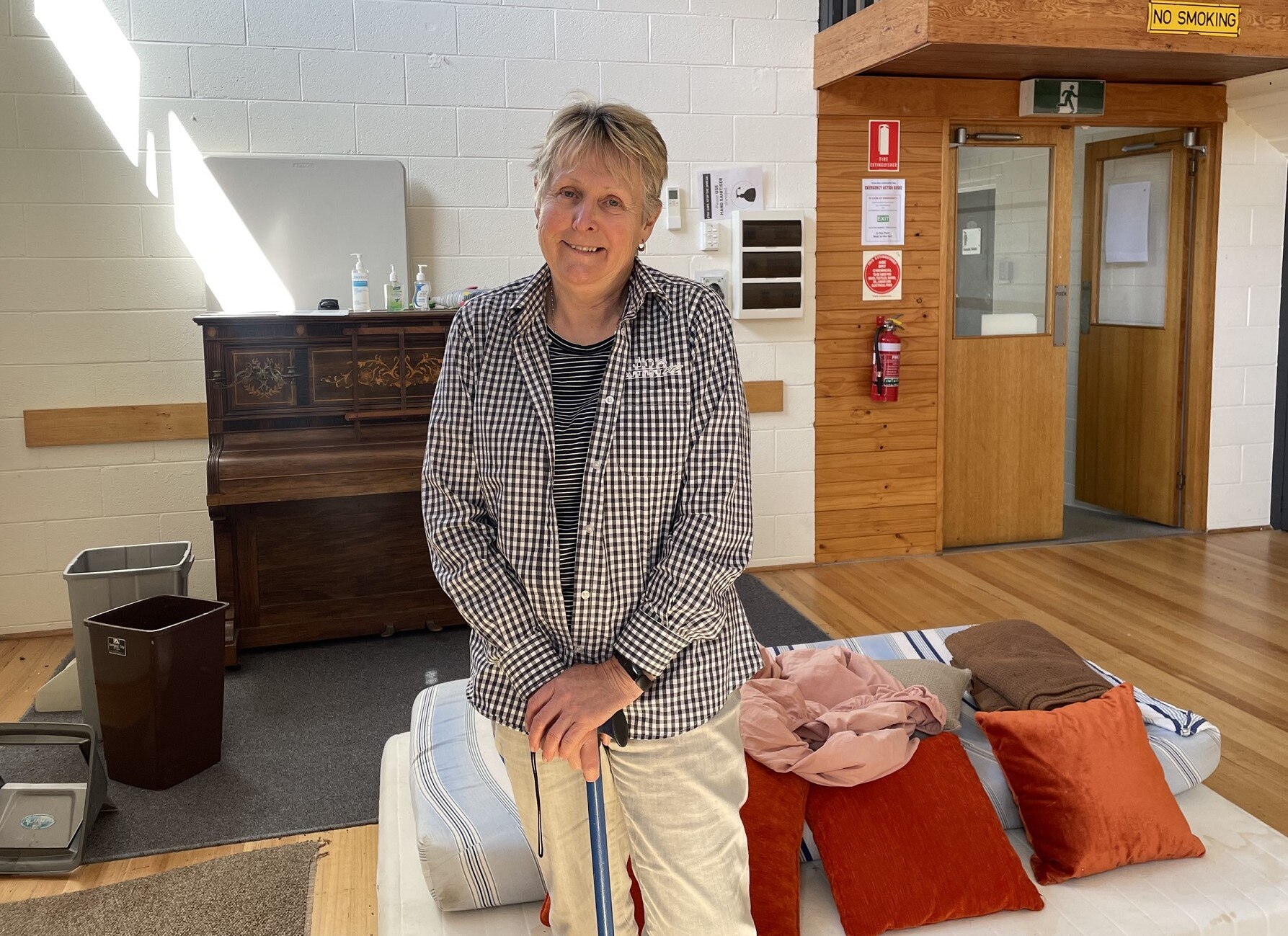 Barbara Barrett stands in a community hall.