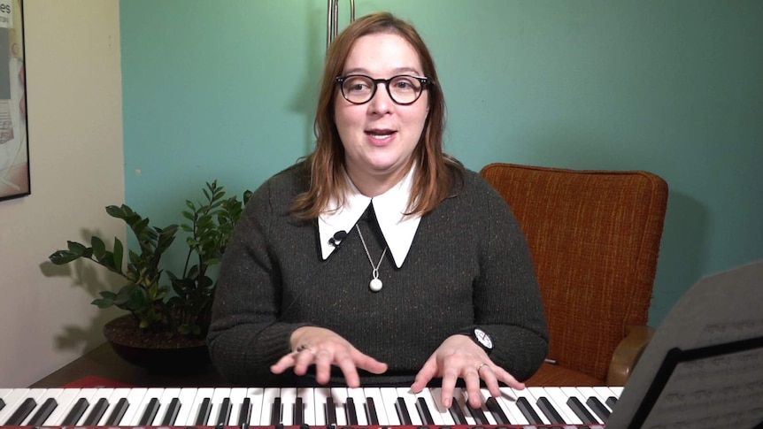 Vanessa Hughes at an electronic keyboard.