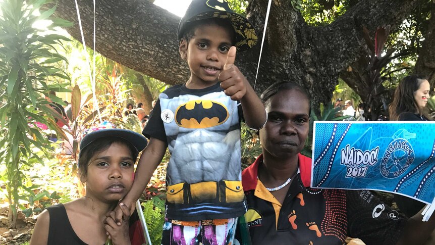 Mother and two children with balloons after NAIDOC march in Darwin