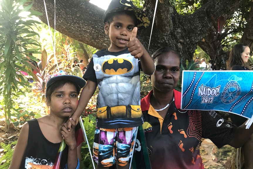 Mother and two children with balloons after NAIDOC march in Darwin