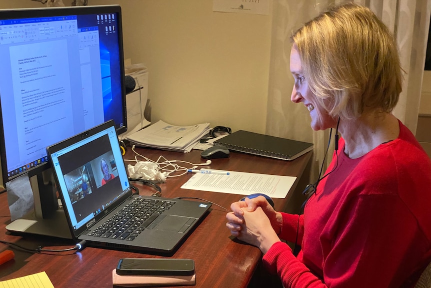 Woman sitting at laptop doing interview with Jordan.