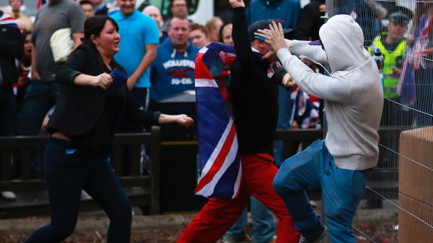 A pro-independence protestor (R) tussles with pro-union protestors during a demonstration at George Square in Glasgow, Scotland September 19, 2014.