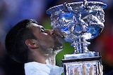Novak Djokovic kisses trophy