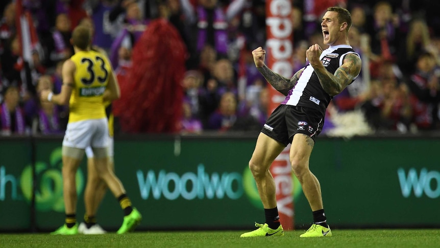 Tim Membrey of the Saints (right) reacts after kicking a goal against Richmond at Docklands.