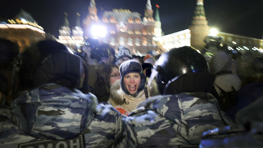 Woman shouts at Russia police at Moscow rally