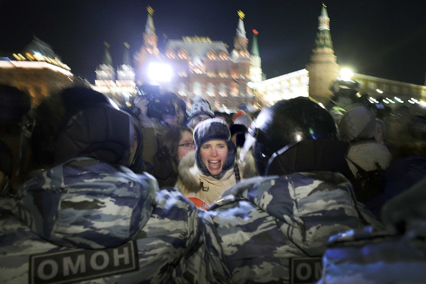 Woman shouts at Russia police at Moscow rally