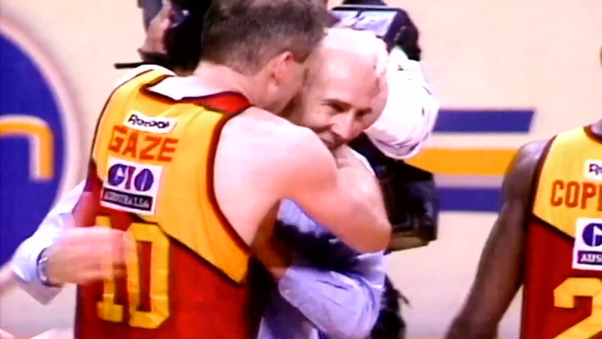 Andrew Gaze and his father Lindsay embracing after winning the 1993 NBL championship.