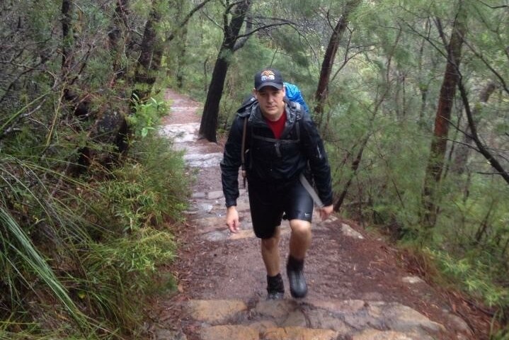 Shane Goodwin trekking in the bush.