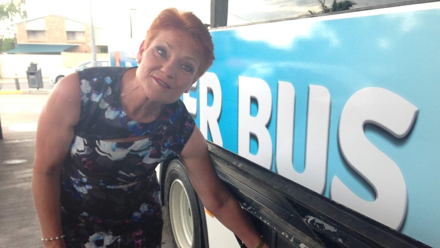 Pauline Hanson fills up her campaign 'battler bus' with fuel during the Queensland election campaign 2017.