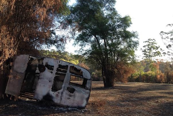 Burnt caravan on dairy farm.