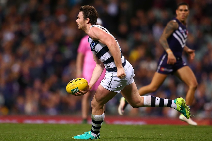 Geelong's Patrick Dangerfield looks to pass the ball against Fremantle at Subiaco Oval.