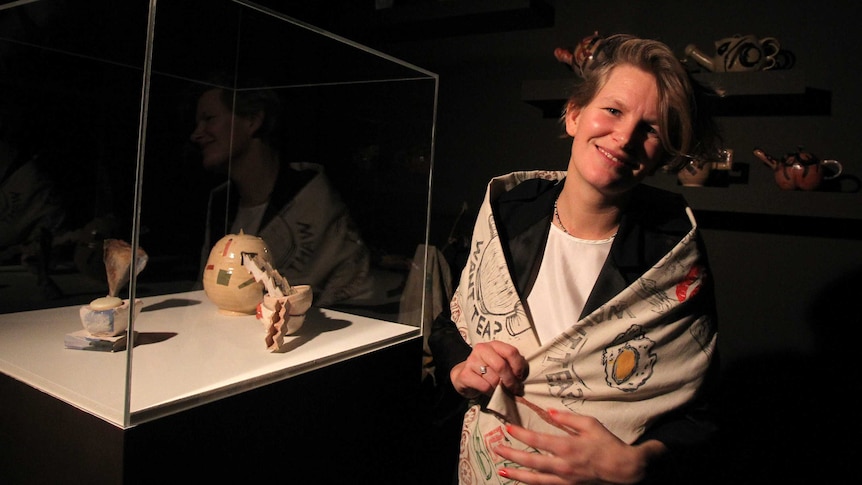 French artist Laure Prouvost poses with her artwork Wantee, after she was announced as the winner of the 2013 Turner Prize.