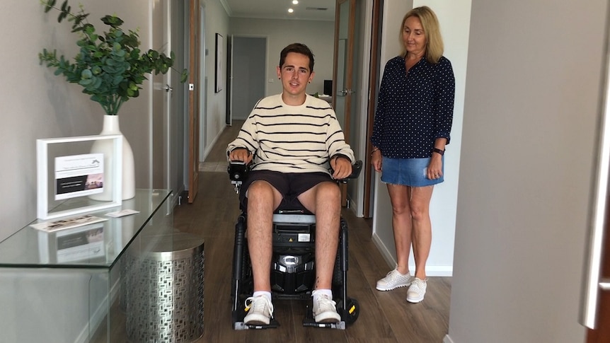 Nick Dempsey who suffers from quadriplegia is in the doorway of 'Nick's Journey House' in Thurgoona with his mother Trudy.