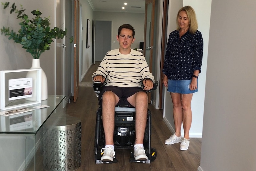 Nick Dempsey who suffers from quadriplegia is in the doorway of 'Nick's Journey House' in Thurgoona with his mother Trudy.