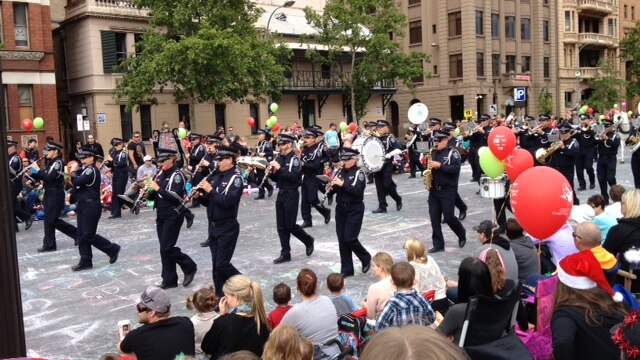 A marching band proceeds through the Adelaide Christmas pageant