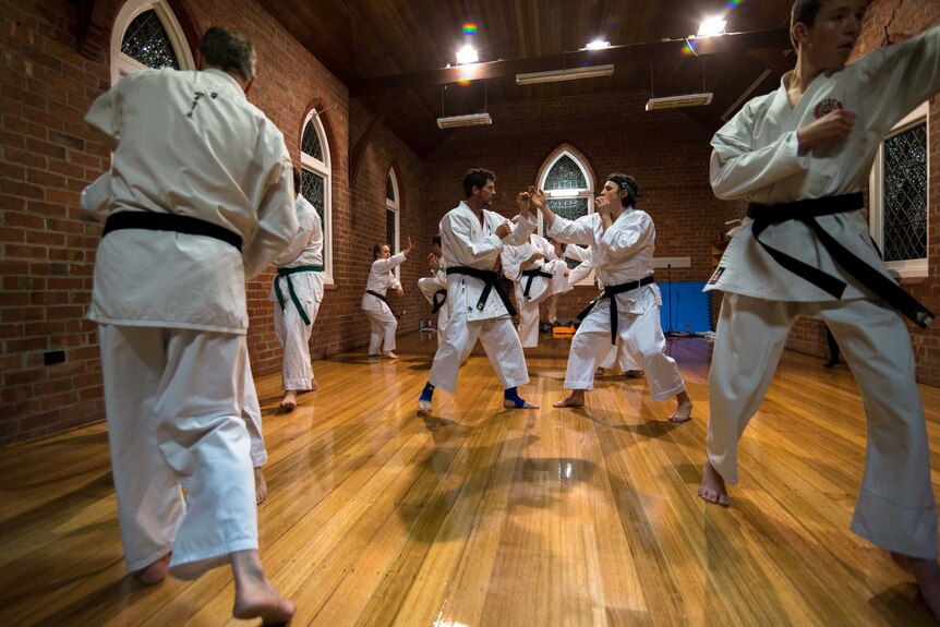 Goju-Ryu karate class practice their moves in Sandford, Tasmania