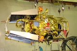 Russian Federal Space Agency specialists prepare the Phobos-Grunt spacecraft on October 18, 2011.