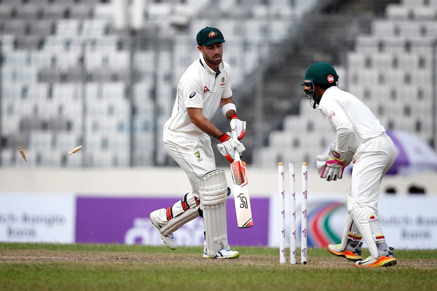 Glenn Maxwell  looks on in despair as his bails are removed by the Bangladesh wicketkeeper Mushfiqur Rahim.