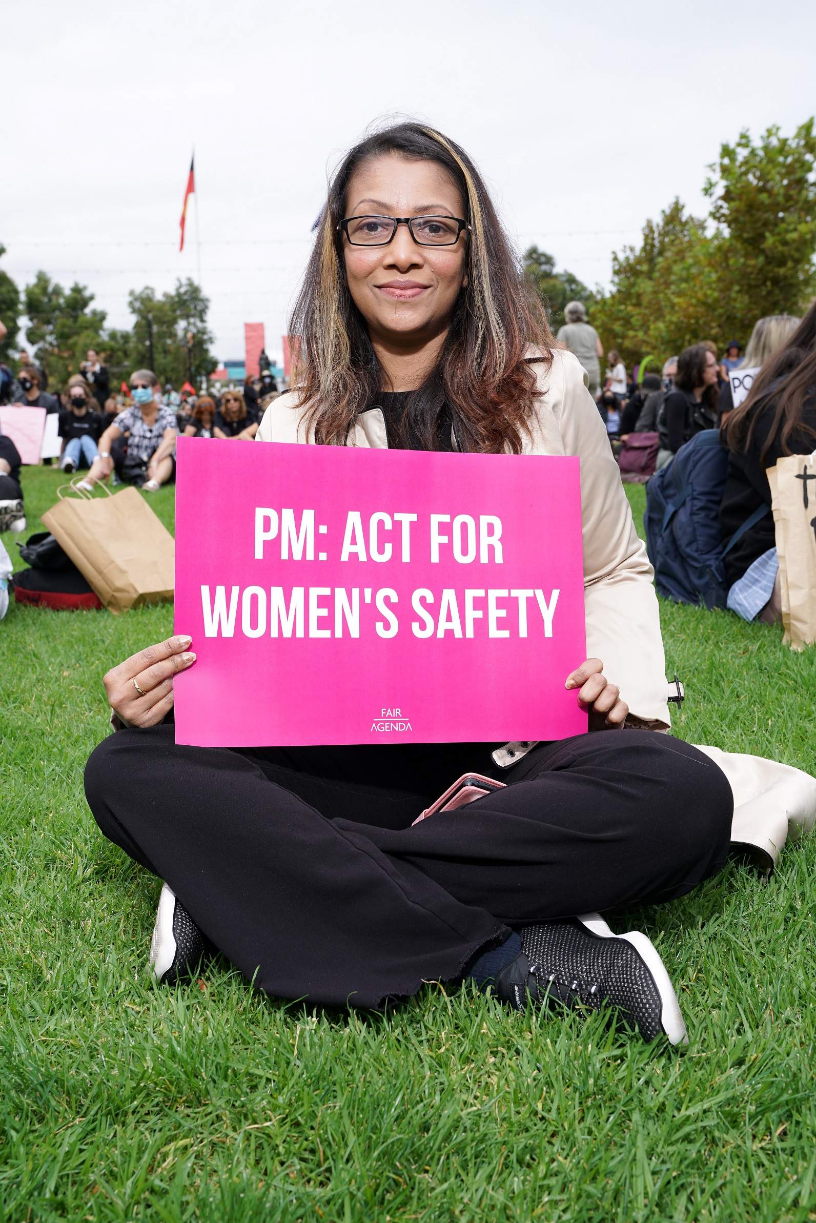 Protester at Victoria Square holding a placard.