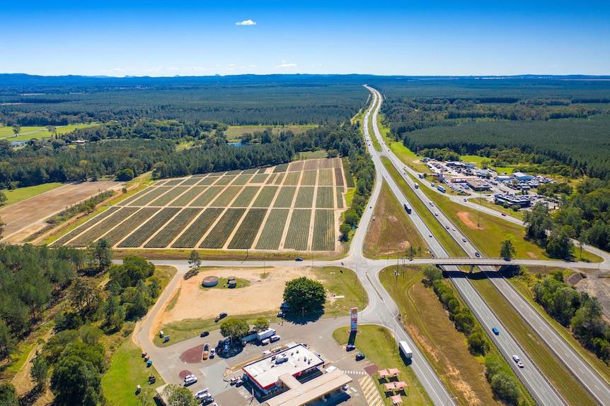 Aerial shot of site, with farm clearly visible next to highway