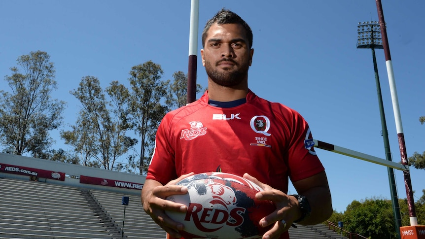 Karmichael Hunt poses in Queensland Reds kit