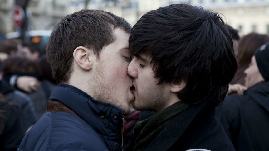 Two men kiss in Paris