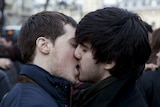 Two men kiss in Paris