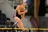Lilly Barker jumps in the air and tucks her legs under as she clears a skipping rope.