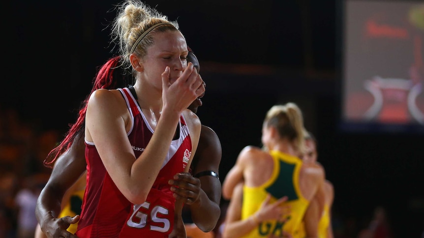 English netballer Joanne Harten is dejected after her team's loss to Australia.