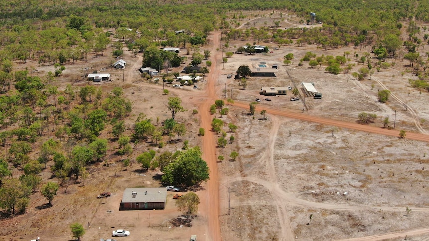 A drone photo of Mudginberri homeland in Kakadu. At least 12 homes can be seen from the air, and the water tank is visible.