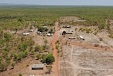 A drone photo of Mudginberri homeland in Kakadu. At least 12 homes can be seen from the air, and the water tank is visible.