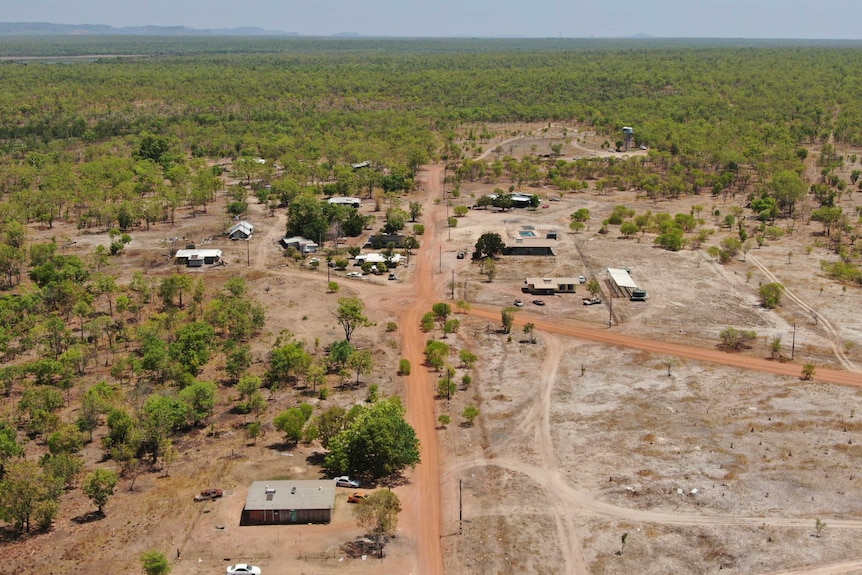 A drone photo of Mudginberri homeland in Kakadu. At least 12 homes can be seen from the air, and the water tank is visible.