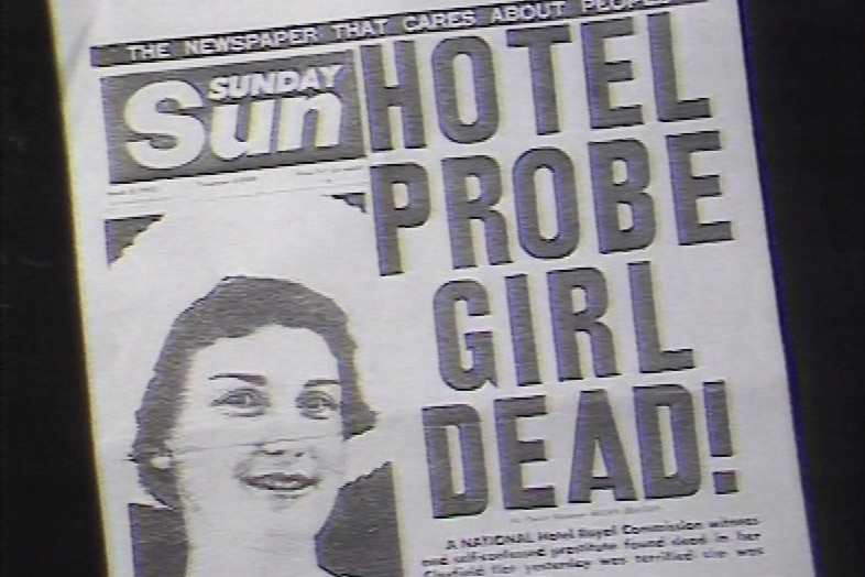 A black and white photo of a newspaper front cover with the headline: "Hotel probe girl dead!"