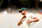 Josh Hazlewood leans back and puffs out his cheeks