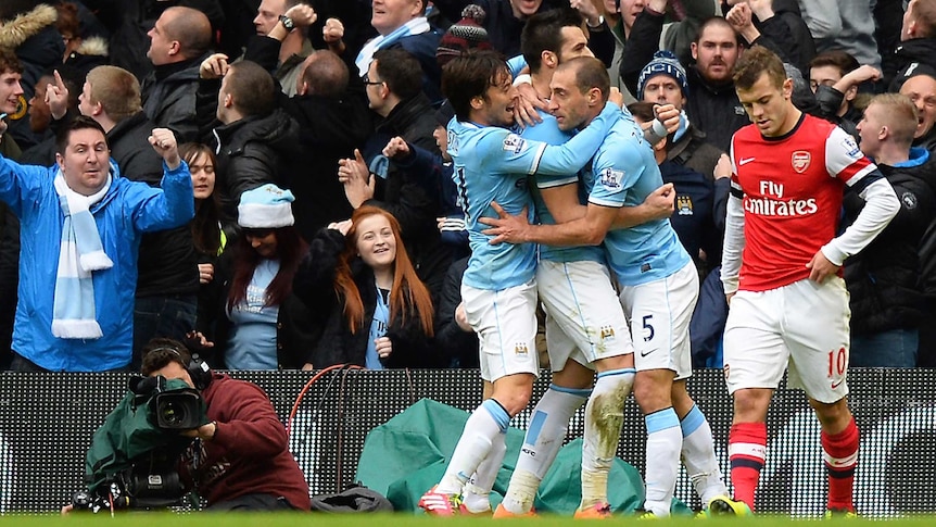 Manchester City celebrates Alvaro Negredo's goal against Arsenal