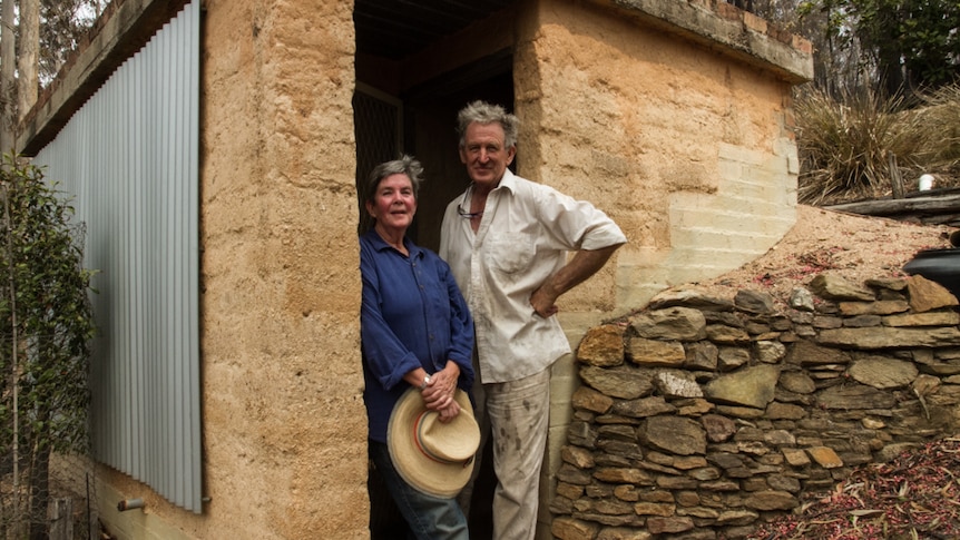 Mick Harewood and Sue Norman at the fire bunker they built on their property