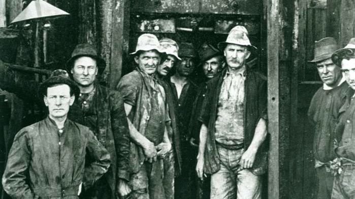 Engineer W.R.H. Melville with some miners who worked on the Greenwich to Balmain tunnel under Sydney Harbour.