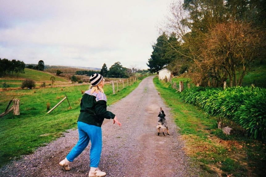 Amy playing catch with her dog