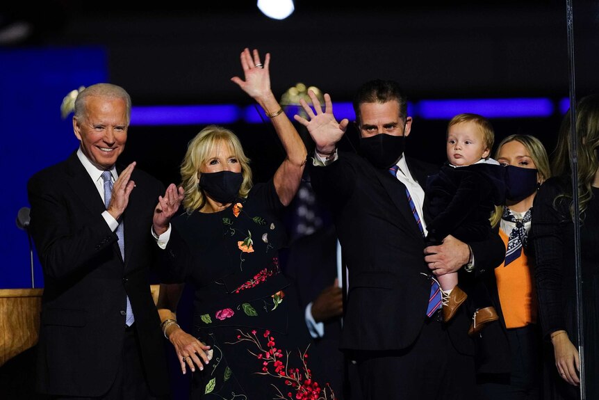 Joe Biden smiles and claps alongside his wife Jill and son Hunter after his victory speech.