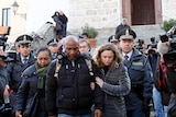 Relatives of the victims of the Costa Concordia cruise ship exit a church