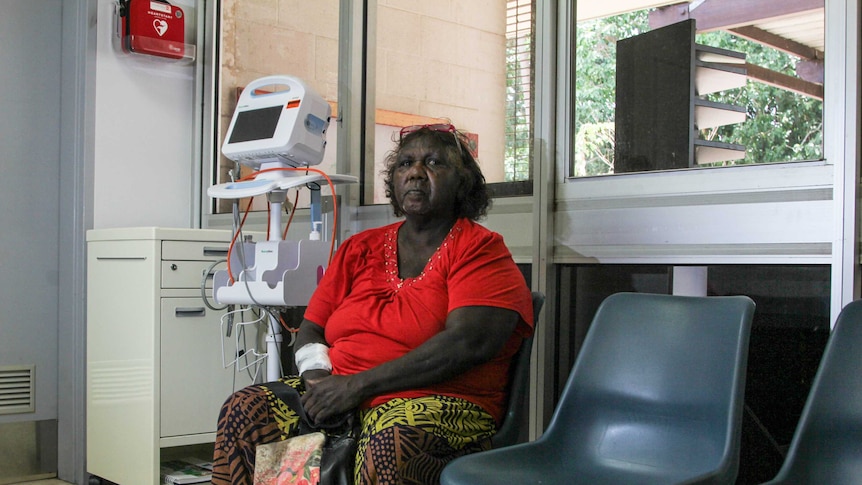 A photo of Tiwi Island woman Anne Marie Puruntatameri sitting on a chair in a dialysis clinic.