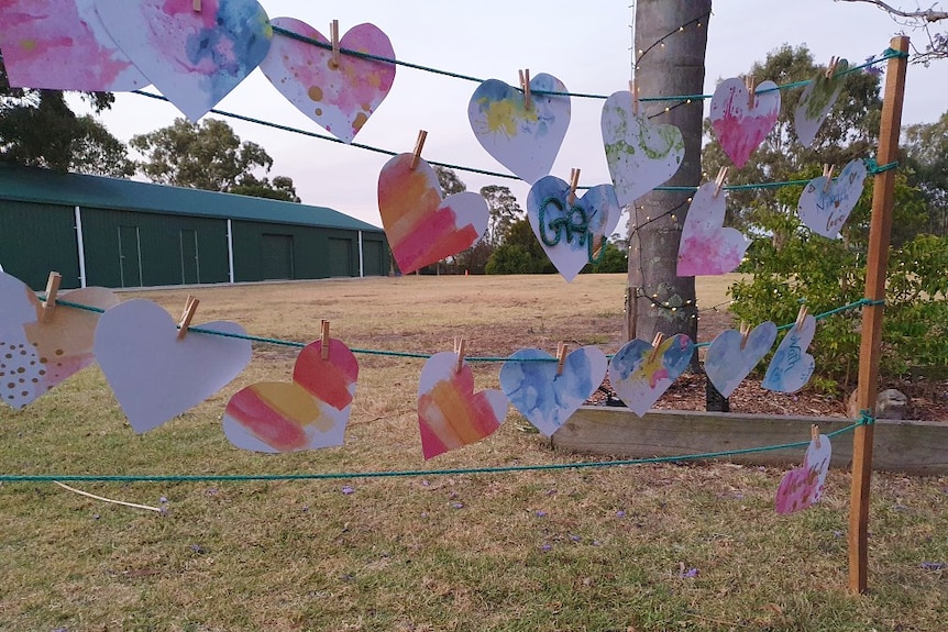 paper love hearts hanging outdoors
