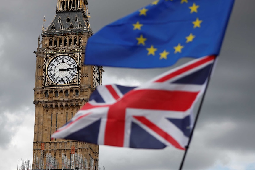 Flags wave in front of London's Big Ben