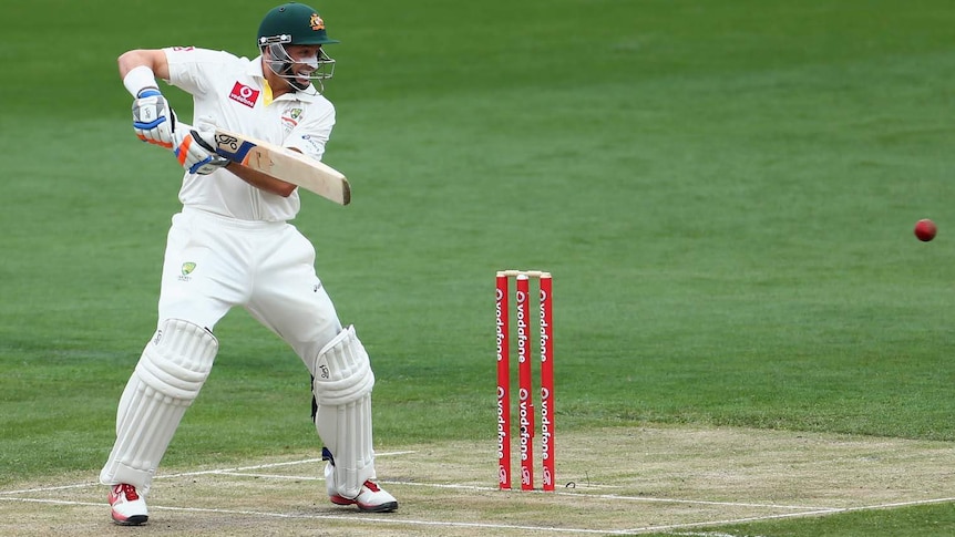 Making hay... Mike Hussey bats late on day one.