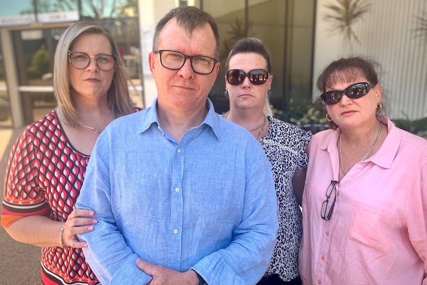 Melissa, Andrew, Rebecca and Natalie Francis look at the camera outside court.