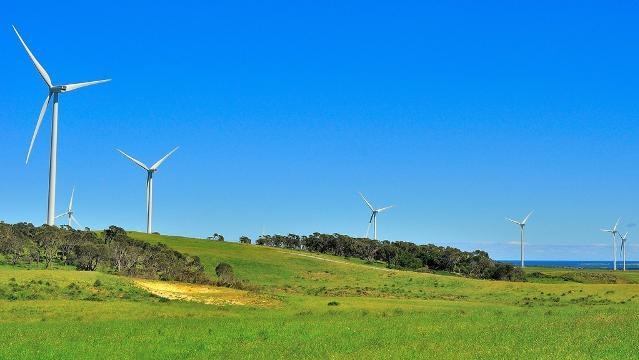 Seven wind turbines in a wind farm