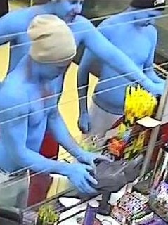 CCTV still of men dressed as Smurfs.
